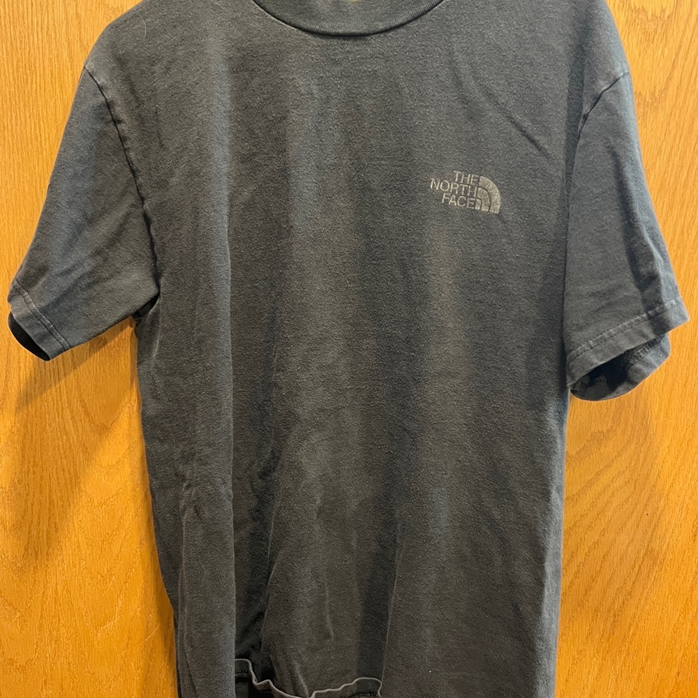 The North Face women’s Charcoal Black Short-Sleeve Logo Tee.